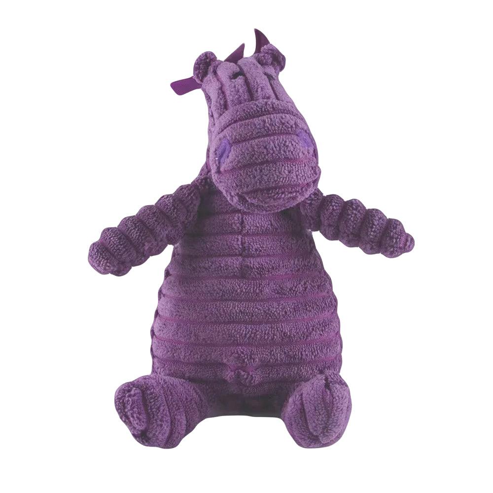 Close-up van Nelly Neushoorn, een paarse pluchen knuffel in zittende houding.