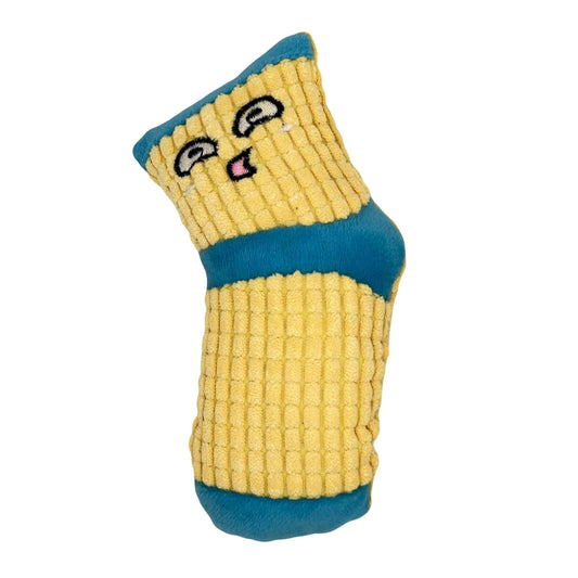 Zacht hondenspeeltje in de vorm van een gele sok met blauwe details en een lachend gezichtje.